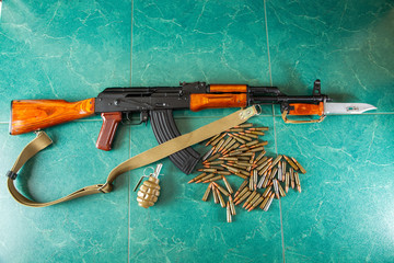 Kalashnikov AK-47 on a green background