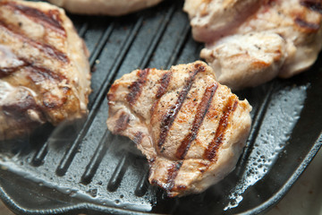 beef steak cooking over flaming grill