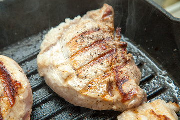 beef steak cooking over flaming grill