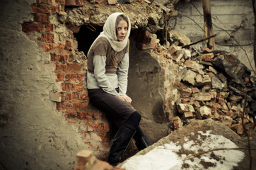 young girl dressed in the poor sweater and scarf
