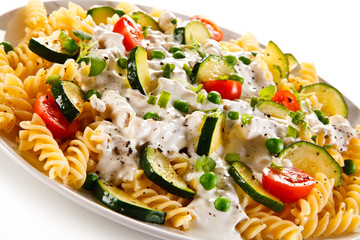 Pasta with white sauce and vegetables