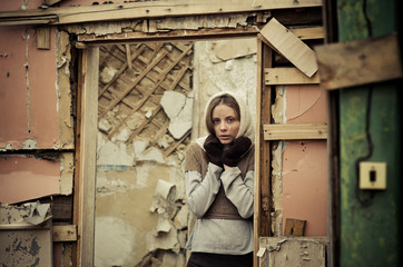 young girl dressed in the poor sweater and scarf