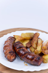 Fried homemade sausages with french fries