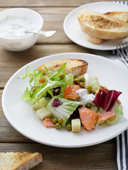 salmon salad on plate