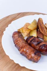 Served meal with sausages and french fries