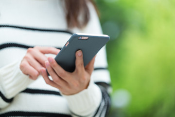 Woman use of cellphone at outdoor