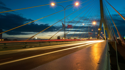 Fototapeta na wymiar The bridge construction on twilight and river reflection at nigh