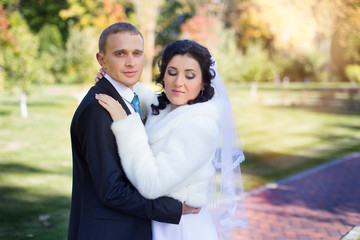 The groom has gently embraced the bride