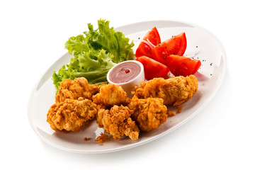 Fried chicken nuggets and vegetables