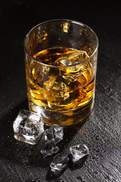 Glass of whiskey with ice