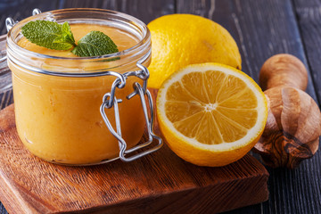 Homemade lemon kurd in a glass jar.