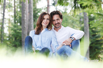 Fototapeta premium Couple sitting on grass