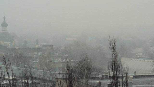 Church Among the Houses in the Snowy Weather