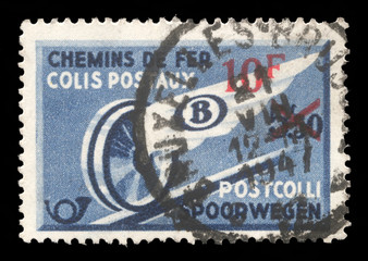 Stamp printed in Belgium shows Winged Wheel with blue surcharge, Railway Stamp issue, circa 1946.