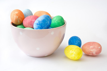 Traditional Easter eggs in a bowl. Isolated photo
