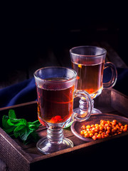 Tea in glasses with sea-buckhorn.