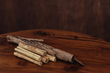 Bunch of cinnamon sticks on wooden table
