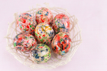 Painted Easter eggs in wicker basket