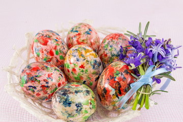 Painted Easter eggs in wicker basket