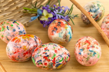 Painted Easter eggs falling out of basket
