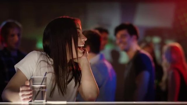 Friends welcoming each other in bar
