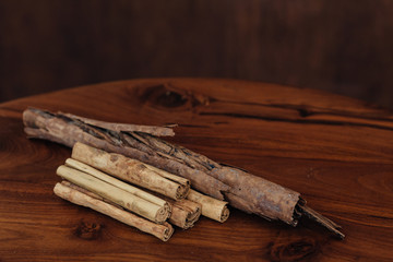 Bunch of cinnamon sticks on wooden table