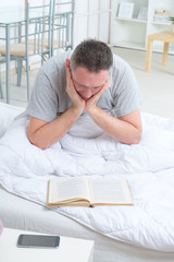 Fototapeta premium Reading book in bed