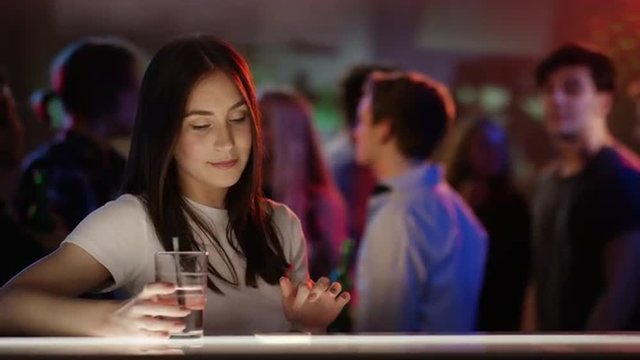 Boy and girl checking each other out in bar