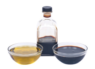 Extra virgin oil and balsamic vinegar in bowl separated on white background