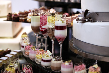 Colorful desserts and pastry served on a wedding party
