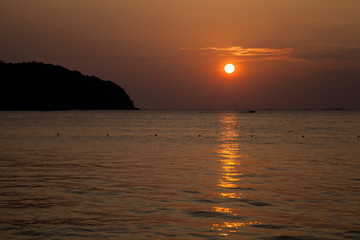 the large orange sunset in Malaysia