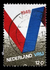 Foto auf Leinwand Stamp printed in the Netherlands issued for the 25th anniversary of Liberation shows V Symbol, circa 1970. © zatletic