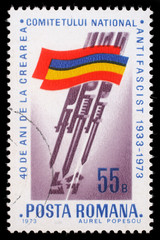 Stamp printed by Romania, shows Romanian flag, Bayonets stabbing Swastika, circa 1973.