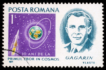 Stamp printed in Romania shows portrait of Yuri Gagarin with inscription and name of series...