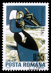 Stamp printed in Romania shows Mother with child and destroyed house, Plight of the Danube flood victims, circa 1970.