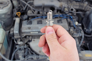 A new spark plug in hand