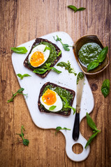 Boiled egg with pesto on toast