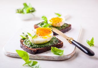 Boiled egg with pesto on toast