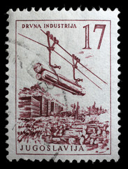 Stamp printed in Yugoslavia shows lumber industry, circa 1958