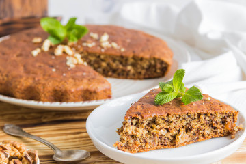 Banana pie slice. Wooden background.