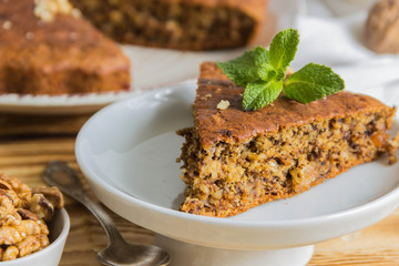 Banana pie slice. Wooden background.