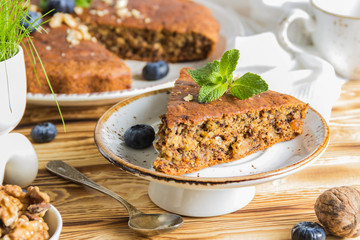 Banana bread with blueberries on a wooden table
