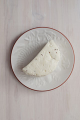 Half of fresh white round cheese