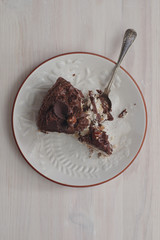 slice of chocolate cake with vintage spoon
