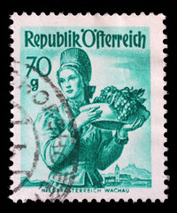 Stamp printed in Austria shows image woman in national Austrian costumes, Lower Austria, Wachau, series, circa 1949