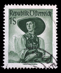 Stamp printed in Austria shows image woman in national Austrian costumes, Tyrol, Puster Valley,series, circa 1951