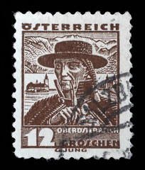 Stamp printed in Austria shows a man in the Austrian national dress with the inscription 