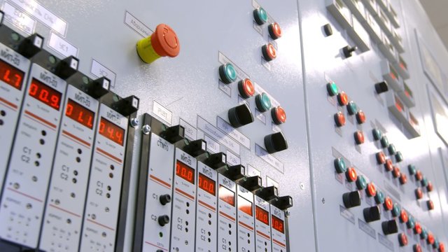 new modern industry control panel with buttons, sensors and switches. Shoot with RED EPIC and slider