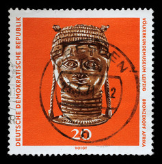 Stamp printed in GDR shows bronze head from Africa, The Ethnography Museum of Leipzig, circa 1971.