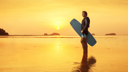 Blond man with the wakeboard